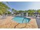The community pool offers a large deck, chairs, shade and clear blue water at 821 Montrose Dr # 201, Venice, FL 34293