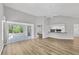 Bright and spacious living room featuring vaulted ceilings and wood-look flooring at 821 Montrose Dr # 201, Venice, FL 34293