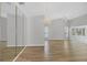 Bright and spacious living room featuring wood flooring, large windows, vaulted ceiling, and elegant chandelier at 821 Montrose Dr # 201, Venice, FL 34293