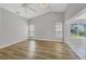 Light-filled living room with vaulted ceiling, wood floors and views to the lanai at 821 Montrose Dr # 201, Venice, FL 34293