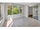 Bright sunroom featuring large windows with views of lush greenery and sliding glass doors for easy access at 821 Montrose Dr # 201, Venice, FL 34293