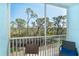 Spacious screened balcony offering serene views of natural landscapes and inviting outdoor relaxation at 8413 Placida Rd # 205, Placida, FL 33946