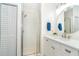 Modern bathroom with glass-enclosed shower, white vanity, and brushed nickel fixtures at 8413 Placida Rd # 205, Placida, FL 33946