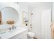 Stylish bathroom featuring a modern mirror, contemporary fixtures, and a combination tub shower at 8413 Placida Rd # 205, Placida, FL 33946