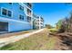 Three-story building featuring a screened-in patio for outdoor relaxation and enjoyment at 8413 Placida Rd # 205, Placida, FL 33946