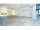 Spacious garage featuring multiple parking bays and ample room for storage at 8413 Placida Rd # 205, Placida, FL 33946