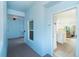 Hallway leading to unit 205, showcasing the door to the apartment and view of the interior at 8413 Placida Rd # 205, Placida, FL 33946