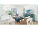 Bright living room with a comfortable seating arrangement and sliding glass doors to the balcony at 8413 Placida Rd # 205, Placida, FL 33946