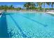 The clear blue water of a community pool is great for exercise or for relaxing in the sun at 8413 Placida Rd # 205, Placida, FL 33946