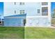 Exterior view of storage units with individual access doors for residents' convenience and enhanced organization at 8413 Placida Rd # 205, Placida, FL 33946