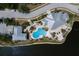 An exclusive aerial view of the clubhouse and pool area, showcasing resort-style amenities for residents to enjoy in a relaxed setting at 8500 Amberjack Cir # 102, Englewood, FL 34224
