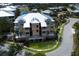 A stunning aerial view of the condominium complex, nestled amidst lush greenery and serene waterways, offering a tranquil retreat at 8500 Amberjack Cir # 102, Englewood, FL 34224
