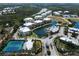 Aerial shot of community with lush landscaping, lakes, and multiple community amenities at 8500 Amberjack Cir # 102, Englewood, FL 34224