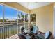 Screened balcony with outdoor seating and water views, perfect for enjoying the Florida sunshine at 8500 Amberjack Cir # 102, Englewood, FL 34224