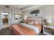 Comfortable bedroom with en-suite bathroom, neutral colors, and stylish decor at 8500 Amberjack Cir # 102, Englewood, FL 34224