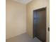 Interior image featuring the building elevator with neutral colored walls and steel doors for easy and convenient access to various floors at 8500 Amberjack Cir # 102, Englewood, FL 34224