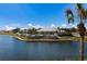 Beautiful lakefront community center with outdoor seating areas and lush landscaping at 8500 Amberjack Cir # 102, Englewood, FL 34224