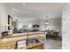Open concept kitchen with granite countertops overlooking living and dining area at 8500 Amberjack Cir # 102, Englewood, FL 34224