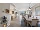 Bright and airy living room and dining area with sliding doors to a balcony and neutral decor at 8500 Amberjack Cir # 102, Englewood, FL 34224