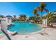 Sparkling community pool surrounded by lush landscaping, offering residents a refreshing oasis to unwind and socialize at 8500 Amberjack Cir # 102, Englewood, FL 34224
