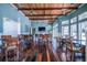 Spacious recreation room perfect for socializing, featuring wood floors, a wood plank ceiling and comfortable seating at 8500 Amberjack Cir # 102, Englewood, FL 34224
