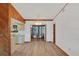 Open dining room flows to kitchen and lanai, with wood accents and abundant light at 9149 Castlehill Ave, Englewood, FL 34224