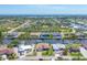 Stunning aerial view of a waterfront community with canal access and lush greenery at 9574 Arsipe Cir, Port Charlotte, FL 33981