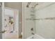 Updated bathroom showcasing marble tile walls and modern fixtures at 9574 Arsipe Cir, Port Charlotte, FL 33981