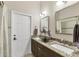 Bathroom featuring double sinks and granite countertops at 9574 Arsipe Cir, Port Charlotte, FL 33981