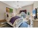 Bright bedroom featuring a ceiling fan and natural light at 9574 Arsipe Cir, Port Charlotte, FL 33981