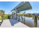 Private boat lift on the canal with direct access to waterways at 9574 Arsipe Cir, Port Charlotte, FL 33981