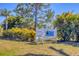 Community sign surrounded by lush landscaping at 9574 Arsipe Cir, Port Charlotte, FL 33981