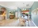 Bright dining room with a modern chandelier, stylish decor and light-colored walls at 9574 Arsipe Cir, Port Charlotte, FL 33981
