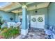 Inviting porch with comfortable seating and charming decor at 9574 Arsipe Cir, Port Charlotte, FL 33981