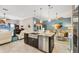 Open concept kitchen with island and stainless steel appliances at 9574 Arsipe Cir, Port Charlotte, FL 33981
