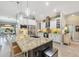 Spacious kitchen with granite island, stainless appliances, and ample cabinet space at 9574 Arsipe Cir, Port Charlotte, FL 33981