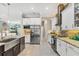 Well-equipped kitchen features stainless steel appliances and granite countertops at 9574 Arsipe Cir, Port Charlotte, FL 33981