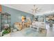 Inviting living room features colorful armchairs, white sofa, and decorative rug at 9574 Arsipe Cir, Port Charlotte, FL 33981