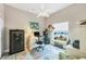 Bright office space features a large window, whimsical decor, and neutral walls with tile floors at 9574 Arsipe Cir, Port Charlotte, FL 33981