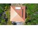 Unique roof design with a private top deck, surrounded by palm trees at 9580 Almirate Ct, Placida, FL 33946
