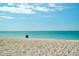 Peaceful beach with clear, turquoise water and blue skies offers pure relaxation at 9580 Almirate Ct, Placida, FL 33946