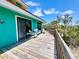 Relaxing deck with ample seating and a tranquil view of natural green space at 9580 Almirate Ct, Placida, FL 33946