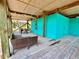 Spacious outdoor deck with wicker furniture and an outdoor dining table perfect for entertaining at 9580 Almirate Ct, Placida, FL 33946