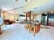 Open living space featuring spiral staircase, kitchen island with barstool seating, and comfortable living at 9580 Almirate Ct, Placida, FL 33946