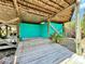 Outdoor shower with a wooden deck to prevent tracking sand indoors after a beach visit at 9580 Almirate Ct, Placida, FL 33946