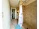 Bathroom featuring a tiled walk-in shower with a shower curtain and a blue bath mat at 9580 Almirate Ct, Placida, FL 33946