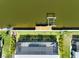 Aerial view of a home featuring a dock, a pool, and lush landscaping on a waterfront lot at 10115 Long Branch St, Port Charlotte, FL 33981