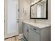 Elegant bathroom showcasing marble countertops, a modern vanity, and a door to the outside at 10115 Long Branch St, Port Charlotte, FL 33981