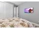 Cozy bedroom with beach-themed decor and a flat-screen TV at 10115 Long Branch St, Port Charlotte, FL 33981