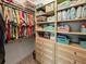 Spacious closet with custom shelving and hanging rods for optimal storage and organization at 10115 Long Branch St, Port Charlotte, FL 33981